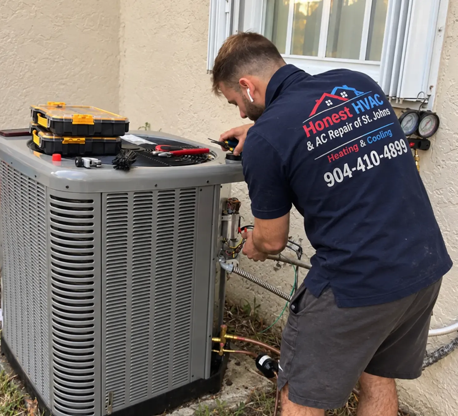 Honest HVAC technician repairing wiring on an outdoor AC condenser
