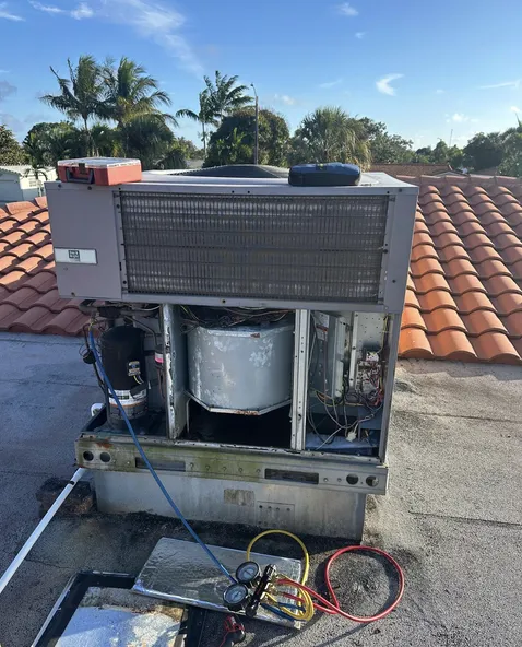 Outdoor AC unit opened up for service and replacement evaluation